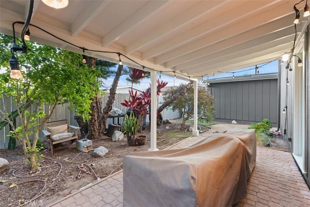 view of patio / terrace featuring fence