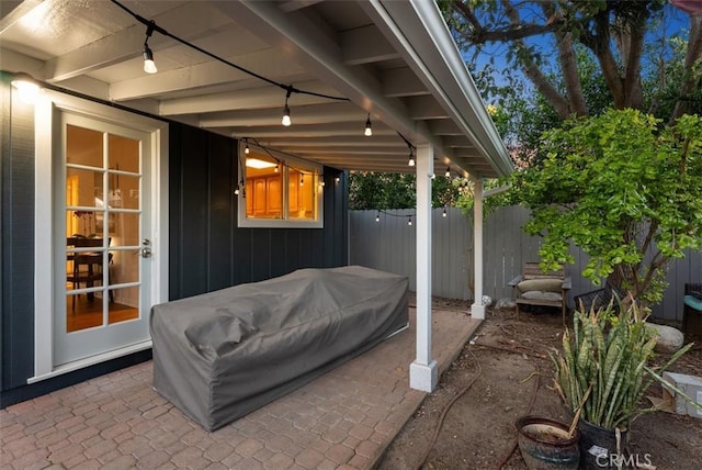 view of patio featuring fence