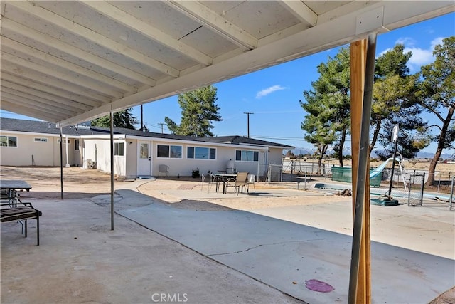 view of patio / terrace featuring fence