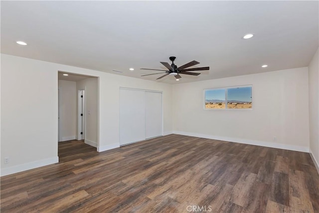 unfurnished room with recessed lighting, baseboards, and wood finished floors