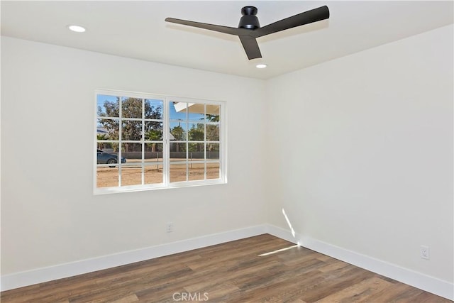 unfurnished room featuring dark wood-style floors, baseboards, a ceiling fan, and recessed lighting