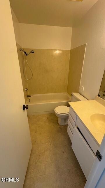 bathroom featuring shower / bathing tub combination, vanity, and toilet