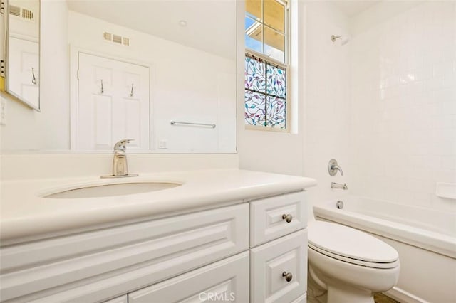 full bath featuring bathtub / shower combination, visible vents, vanity, and toilet