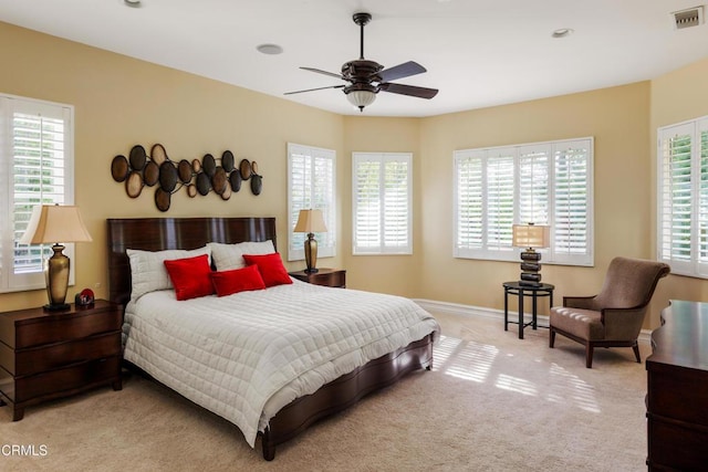 bedroom with recessed lighting, visible vents, a ceiling fan, light carpet, and baseboards