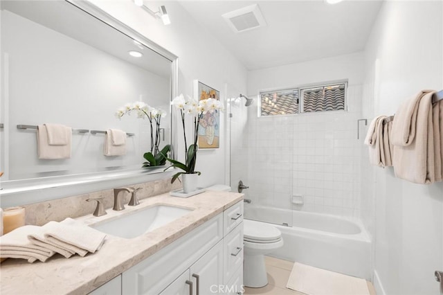 full bath featuring toilet, washtub / shower combination, visible vents, and vanity