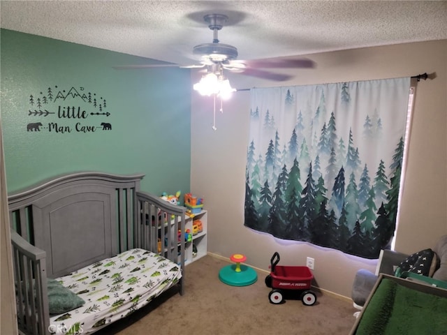 bedroom with carpet floors, a textured ceiling, a ceiling fan, and baseboards