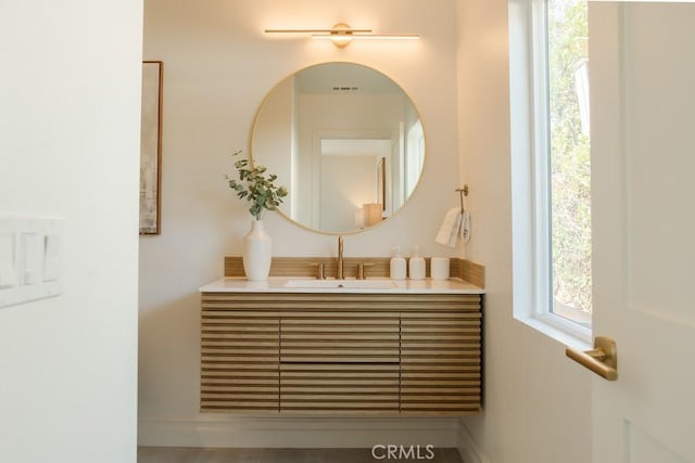 bathroom featuring visible vents and vanity