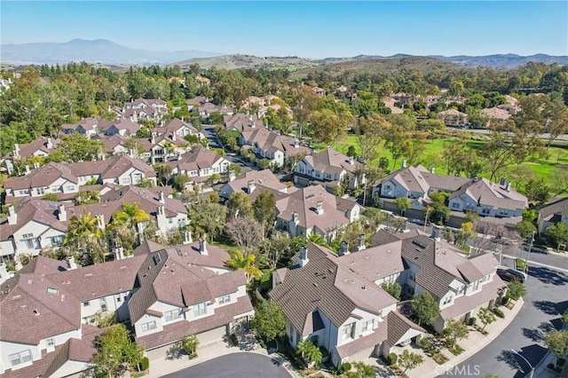 birds eye view of property featuring a residential view and a mountain view