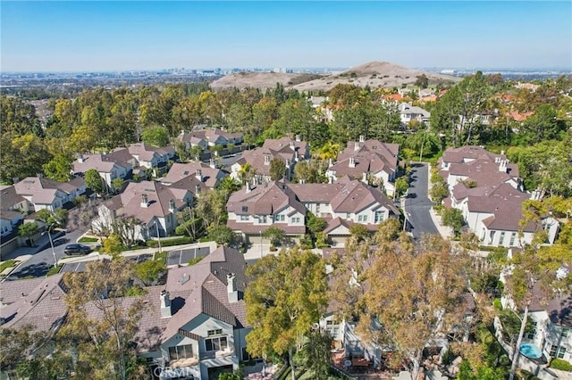 birds eye view of property with a residential view