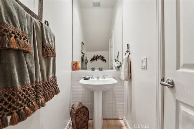 bathroom with visible vents and a sink