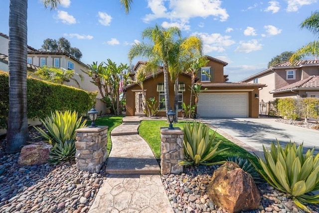 view of front of home featuring stucco siding, a garage, driveway, and fence