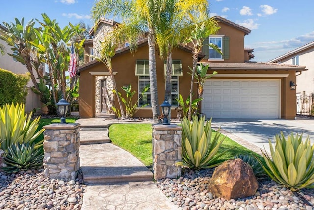 view of front of home with driveway, stucco siding, fence, and a garage
