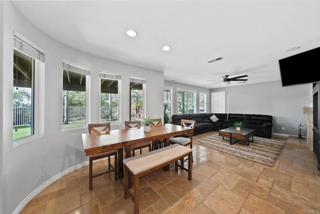 dining area with visible vents, baseboards, stone tile flooring, ceiling fan, and recessed lighting