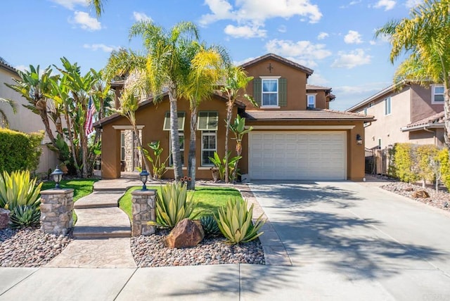view of front of property with fence, stucco siding, a garage, and concrete driveway