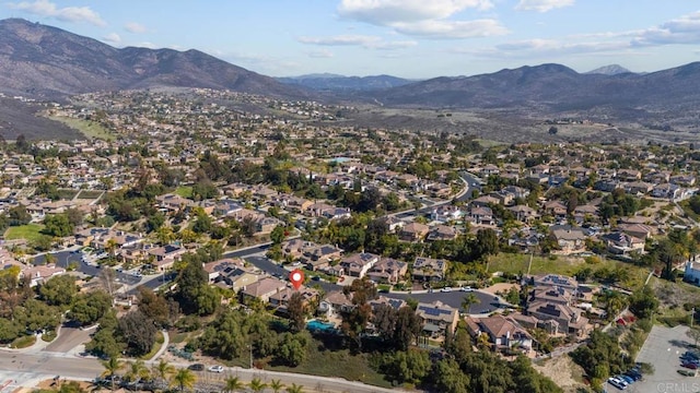 bird's eye view with a residential view and a mountain view