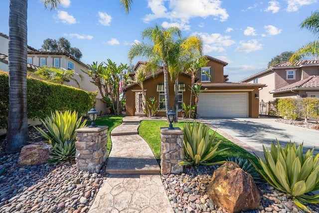 view of front facade with a garage, driveway, fence, and stucco siding