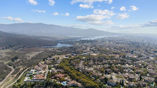 birds eye view of property with a water and mountain view and a residential view