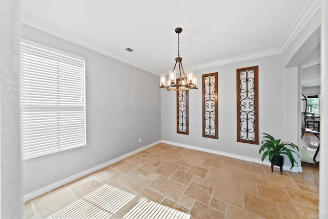 unfurnished room featuring crown molding, stone tile flooring, baseboards, and a chandelier