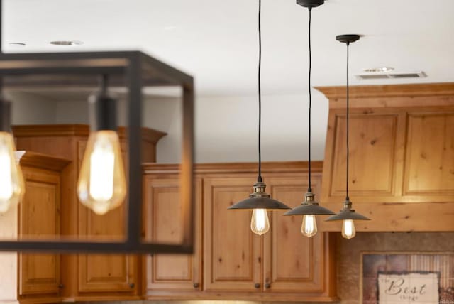 interior details with hanging light fixtures and visible vents