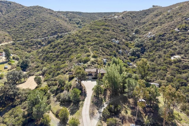 aerial view with a mountain view and a view of trees