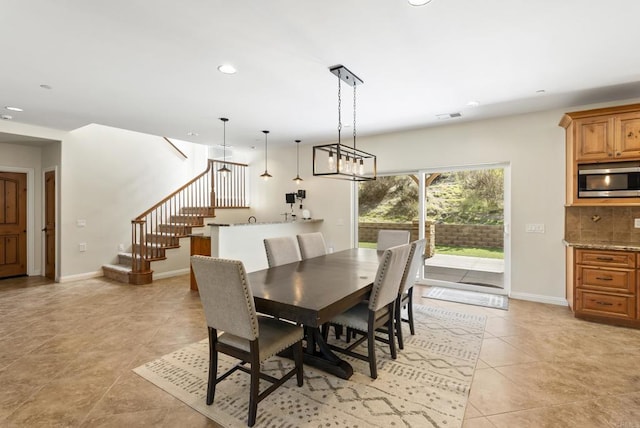 dining area with light tile patterned floors, recessed lighting, visible vents, baseboards, and stairway