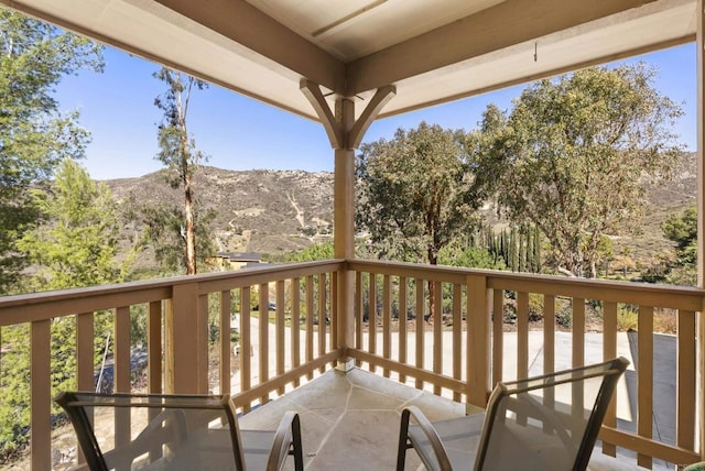 balcony featuring a mountain view