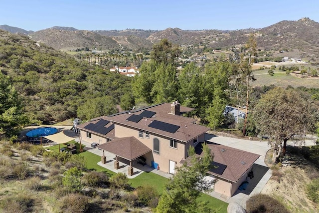 birds eye view of property with a mountain view