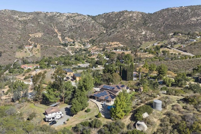 birds eye view of property with a mountain view