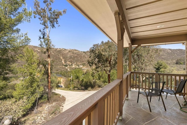 balcony featuring a mountain view