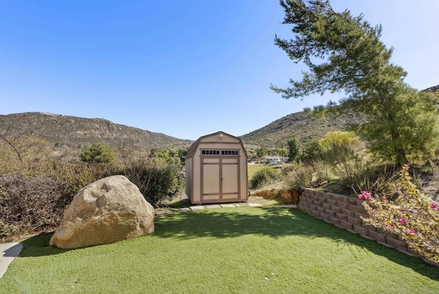 6433 Dehesa Rd, El Cajon, CA 92019 - view of yard with a storage unit, an outbuilding, and a mountain view