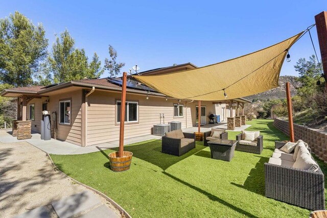 6433 Dehesa Rd, El Cajon, CA 92019 - rear view of property with an outdoor hangout area, solar panels, a patio, and a lawn