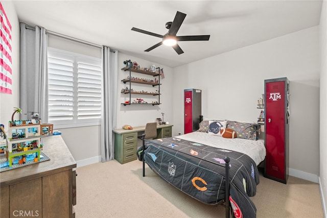 bedroom with baseboards, a ceiling fan, and light colored carpet