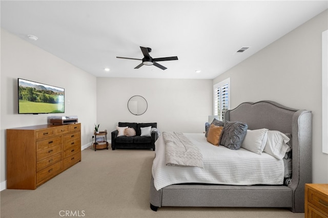 bedroom with a ceiling fan, recessed lighting, light colored carpet, and visible vents