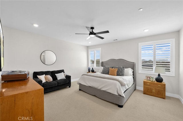 carpeted bedroom with ceiling fan, visible vents, baseboards, and recessed lighting