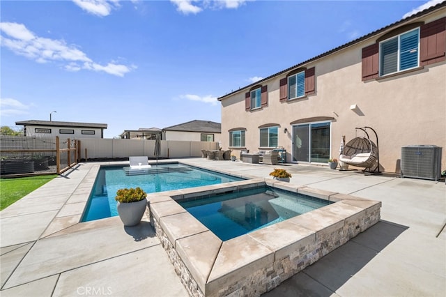 view of swimming pool with a fenced in pool, a patio area, central AC, an in ground hot tub, and a fenced backyard