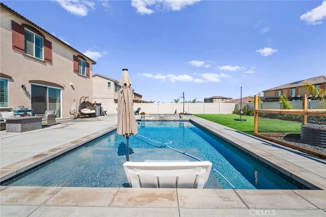 view of pool with a fenced backyard, a lawn, a residential view, a fenced in pool, and a patio area