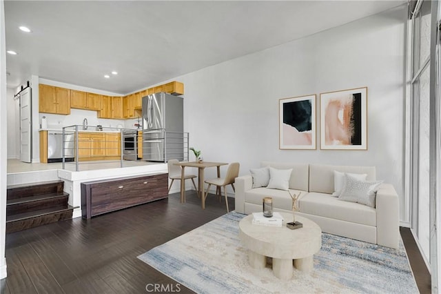 living area featuring recessed lighting and dark wood-style floors