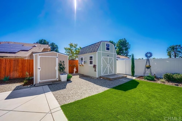 view of shed featuring a fenced backyard