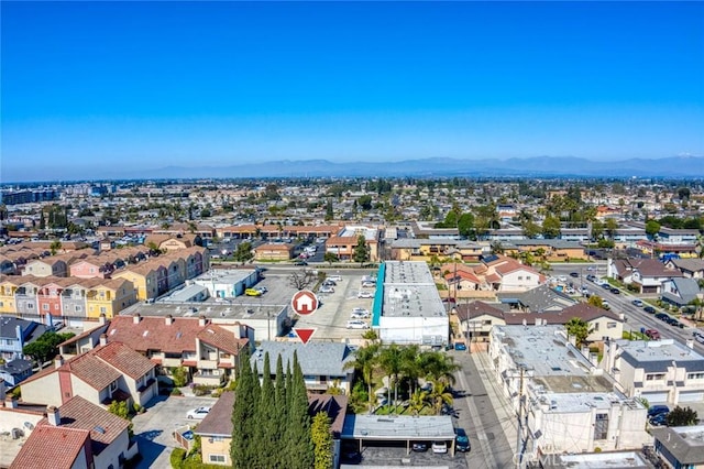 birds eye view of property featuring a mountain view