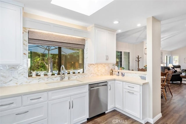 kitchen featuring a sink, dark wood-style floors, white cabinets, light countertops, and dishwasher