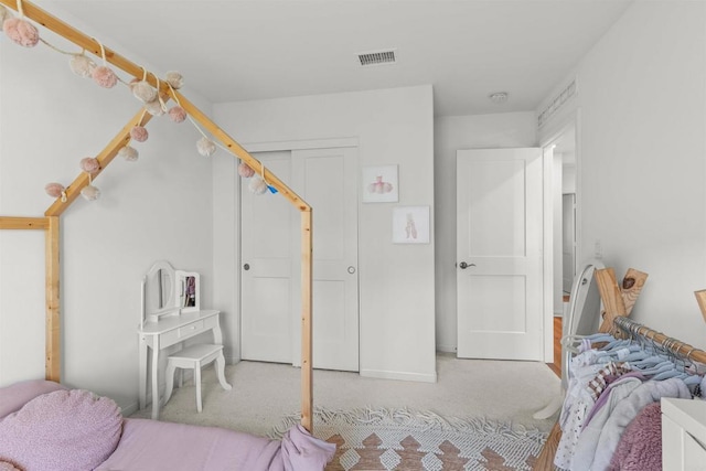 bedroom featuring carpet and visible vents