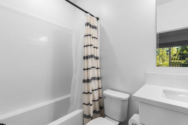 bathroom featuring toilet, shower / bath combination with curtain, and vanity