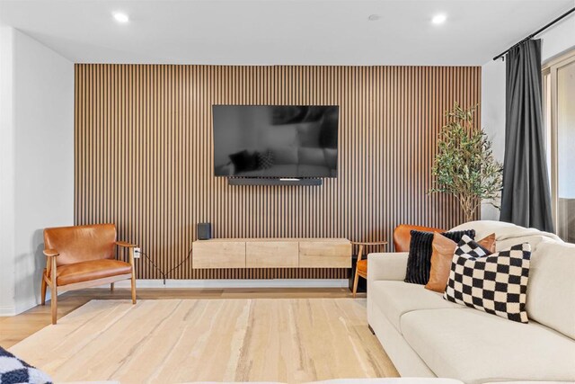 living room with wood finished floors and recessed lighting