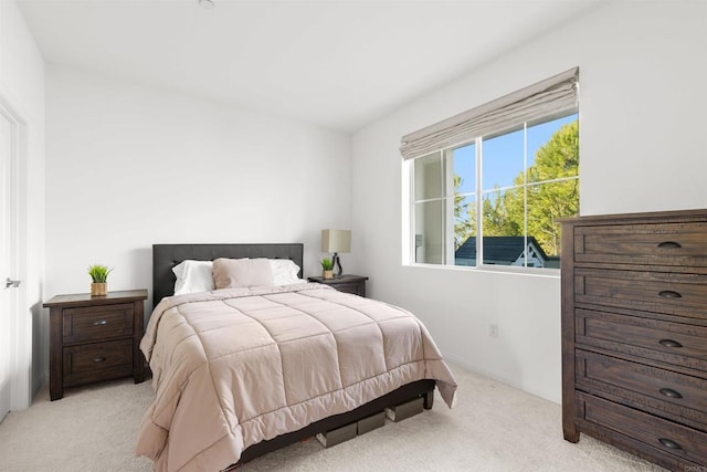 bedroom featuring light carpet