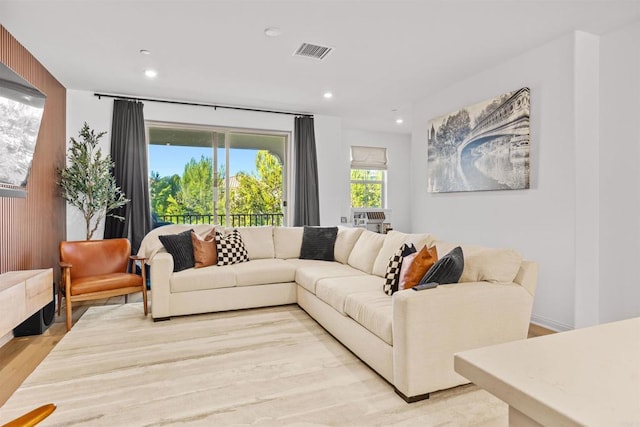 living area featuring recessed lighting, visible vents, and light wood-style flooring