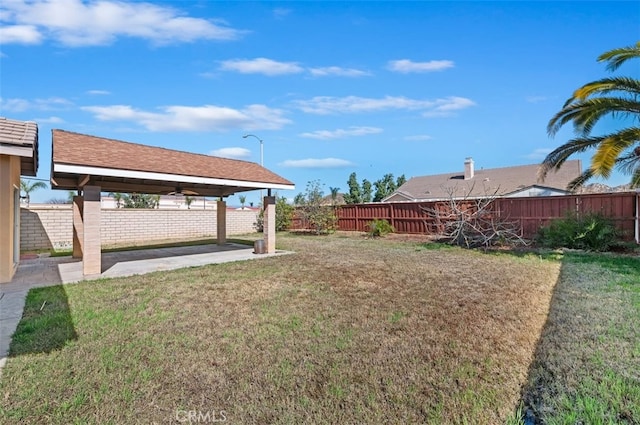 view of yard with a patio and a fenced backyard