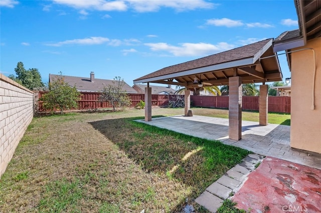 view of yard with a fenced backyard and a patio