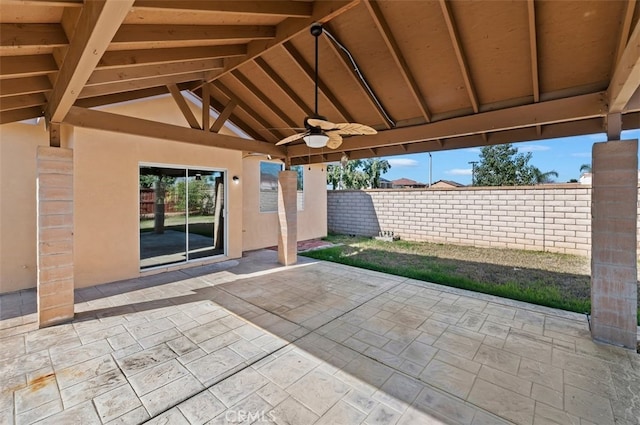 view of patio / terrace featuring ceiling fan and fence