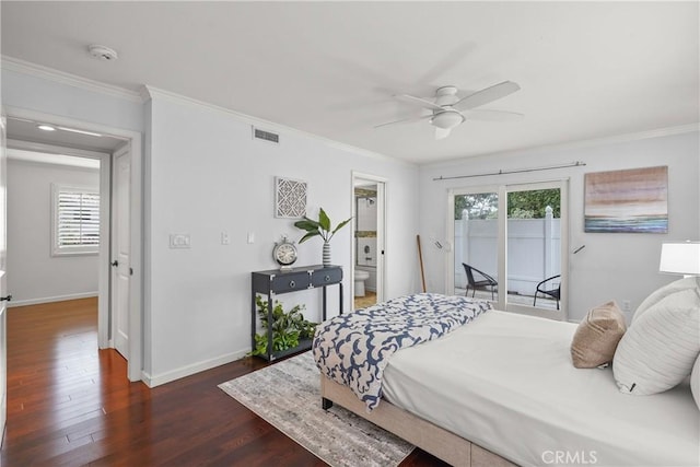 bedroom featuring dark wood-type flooring, multiple windows, crown molding, and visible vents