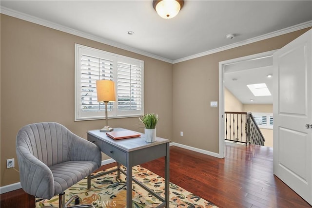 office space with crown molding, a skylight, wood finished floors, and baseboards